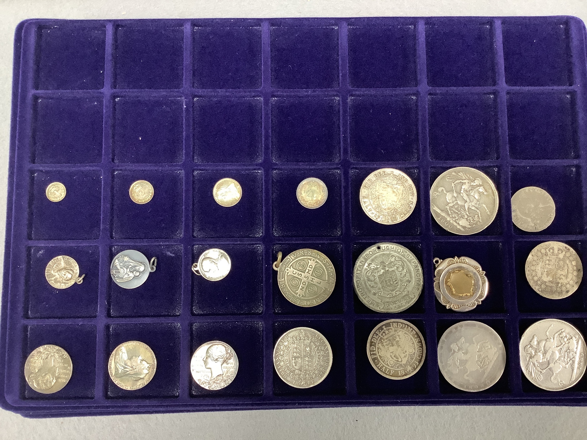 A collection of Indian coins mostly 16th-19th century, and UK silver crowns, half crowns and medals